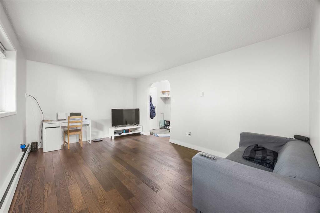 101-3103 Blakiston Drive Nw, Calgary, AB - Indoor Photo Showing Living Room With Fireplace