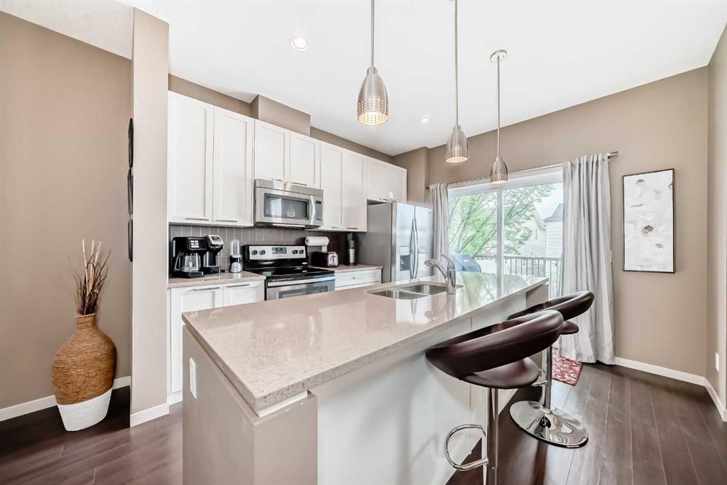 205 Copperpond Row Se, Calgary, AB - Indoor Photo Showing Kitchen With Double Sink With Upgraded Kitchen
