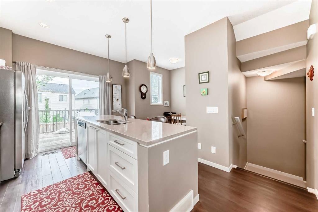 205 Copperpond Row Se, Calgary, AB - Indoor Photo Showing Kitchen With Double Sink