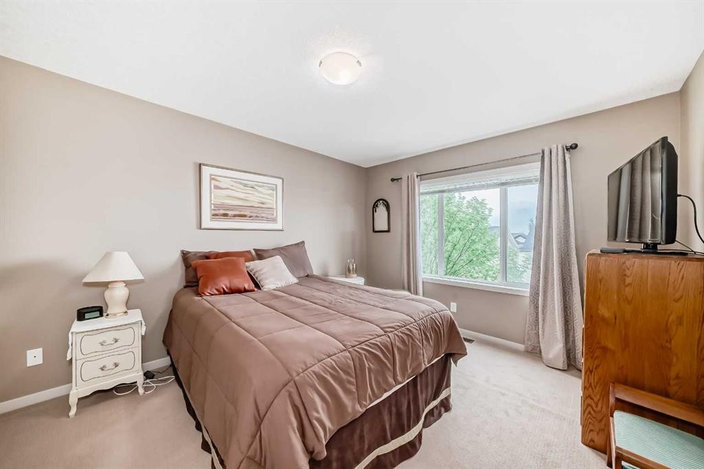 205 Copperpond Row Se, Calgary, AB - Indoor Photo Showing Bedroom