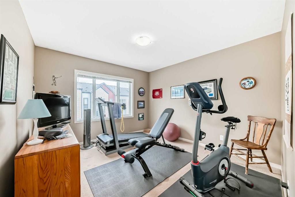 205 Copperpond Row Se, Calgary, AB - Indoor Photo Showing Gym Room