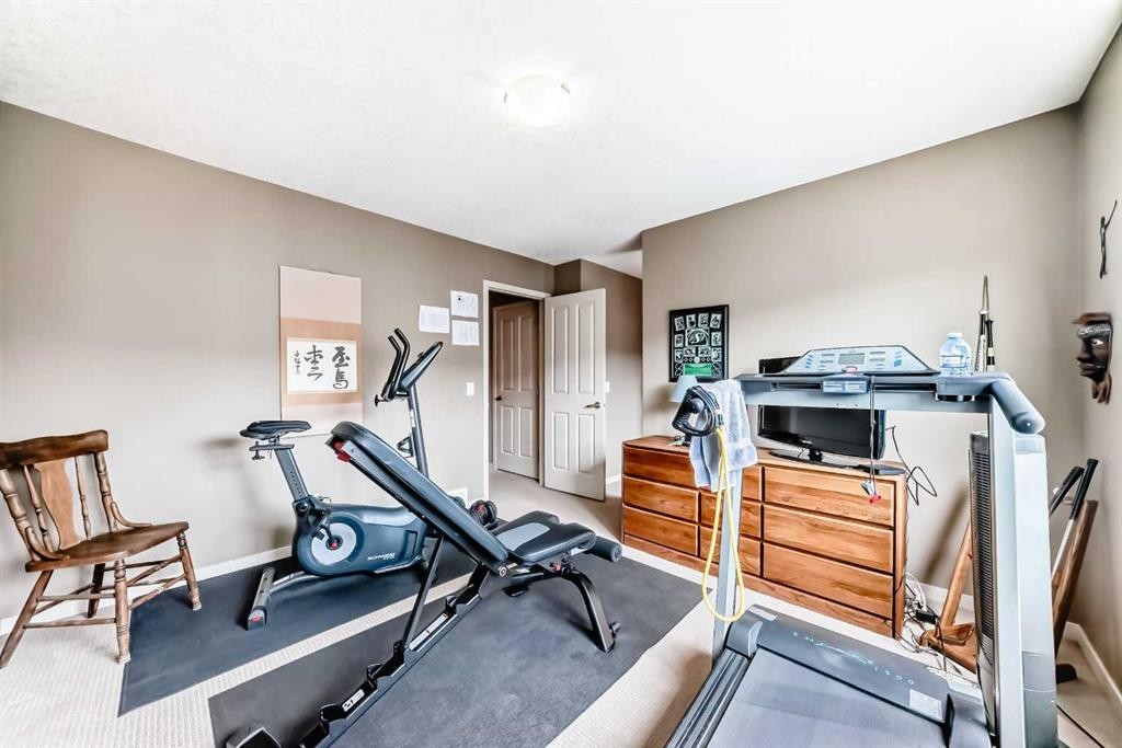 205 Copperpond Row Se, Calgary, AB - Indoor Photo Showing Gym Room
