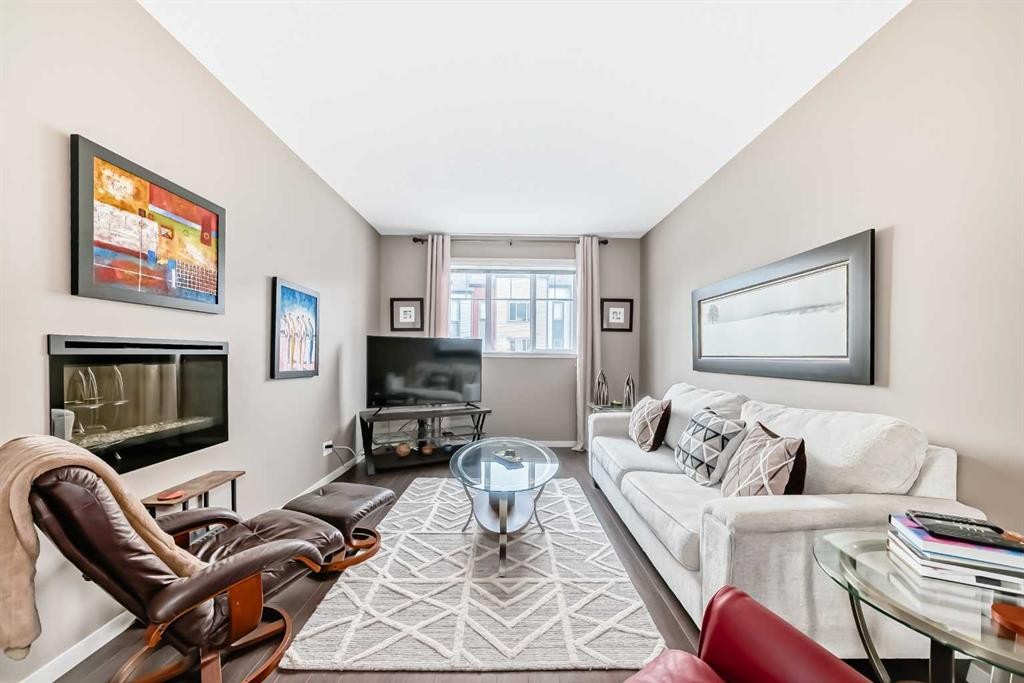 205 Copperpond Row Se, Calgary, AB - Indoor Photo Showing Living Room With Fireplace