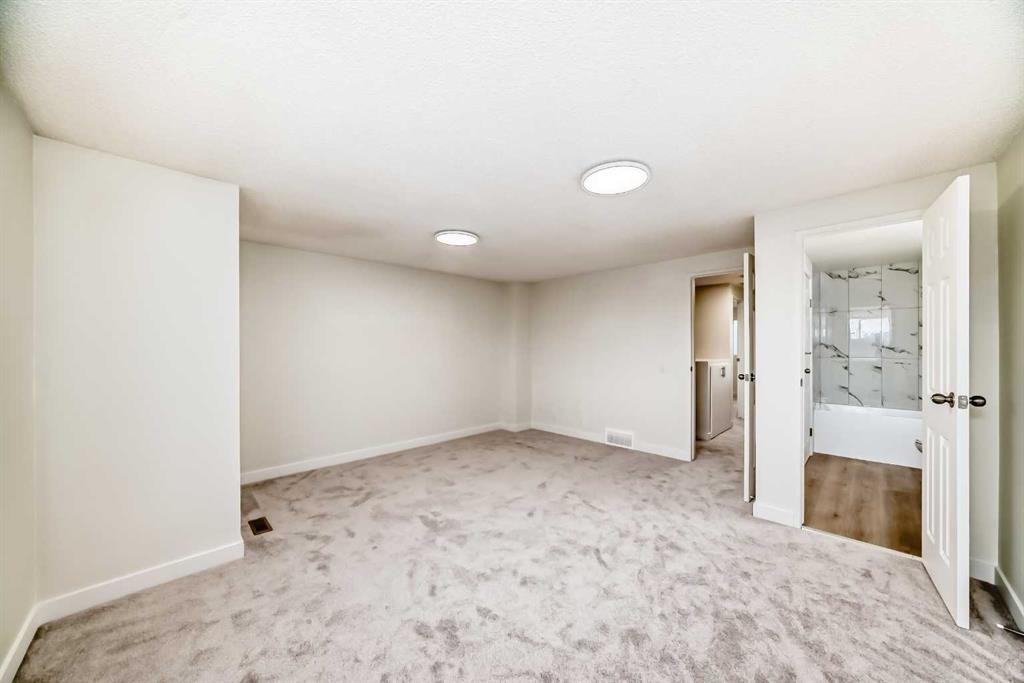 32-1515 Falconridge Drive Ne, Calgary, AB - Indoor Photo Showing Other Room