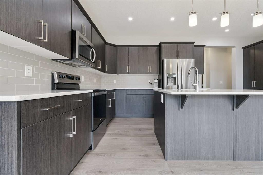 98 Seton Road Se, Calgary, AB - Indoor Photo Showing Kitchen With Upgraded Kitchen