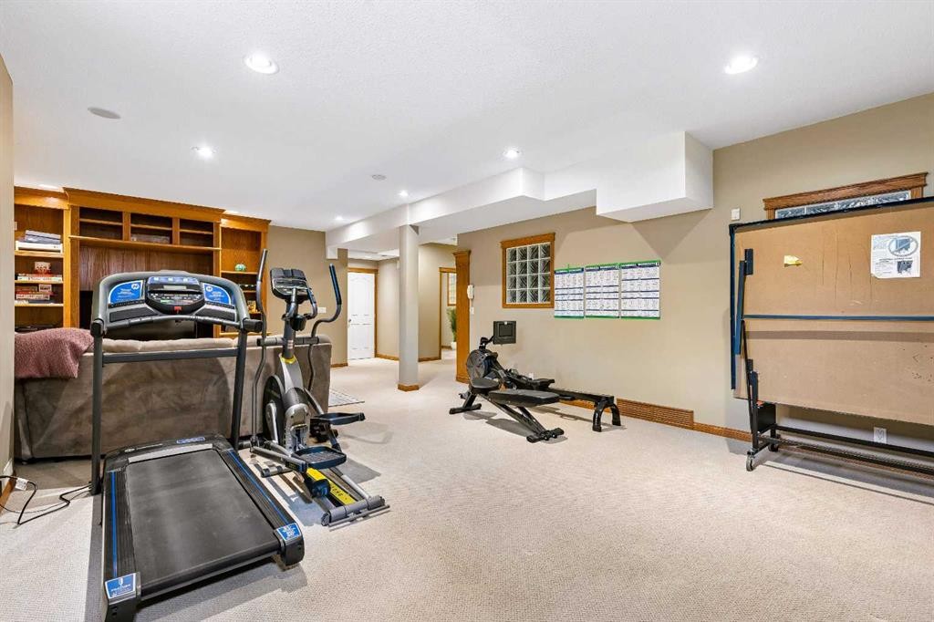 438 Candle Place Sw, Calgary, AB - Indoor Photo Showing Gym Room