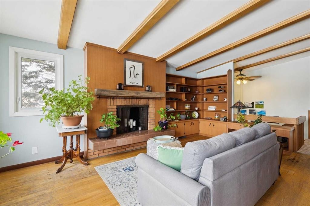 3232 15 Street Nw, Calgary, AB - Indoor Photo Showing Living Room With Fireplace