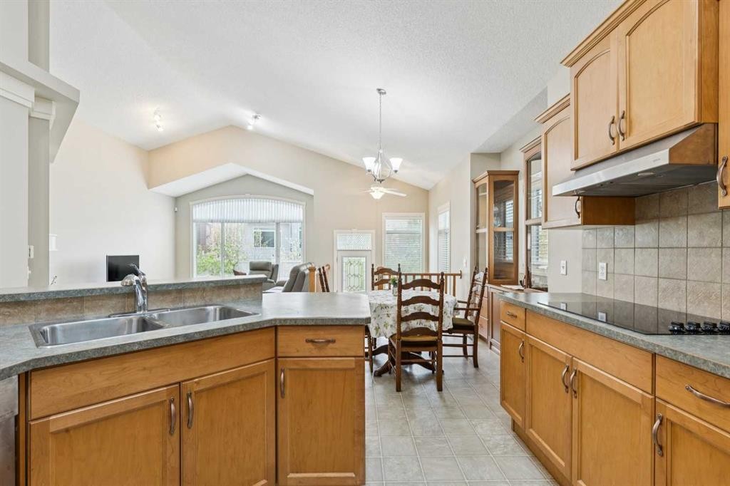 94 Panatella Close Nw, Calgary, AB - Indoor Photo Showing Kitchen With Double Sink