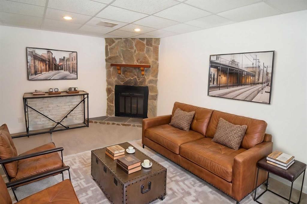 235 Avonburn Road Se, Calgary, AB - Indoor Photo Showing Living Room With Fireplace