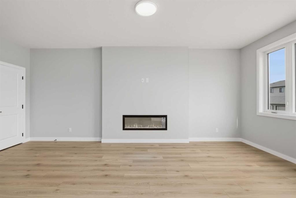 43 Belvedere Crescent Se, Calgary, AB - Indoor Photo Showing Other Room With Fireplace