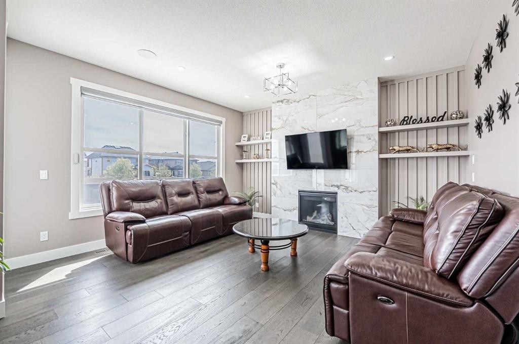 7 Waterford Heights, Chestermere, AB - Indoor Photo Showing Living Room With Fireplace
