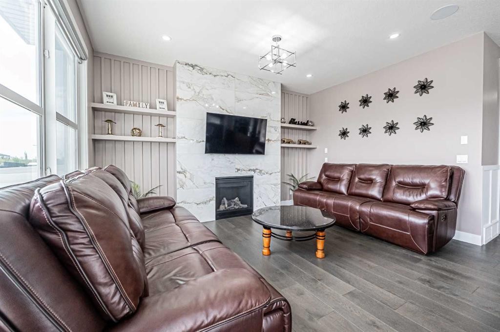 7 Waterford Heights, Chestermere, AB - Indoor Photo Showing Living Room With Fireplace
