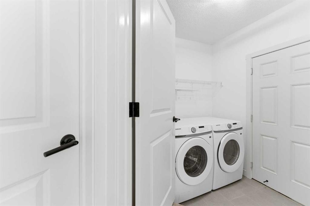 110 Tuscany Summit Green Nw, Calgary, AB - Indoor Photo Showing Laundry Room