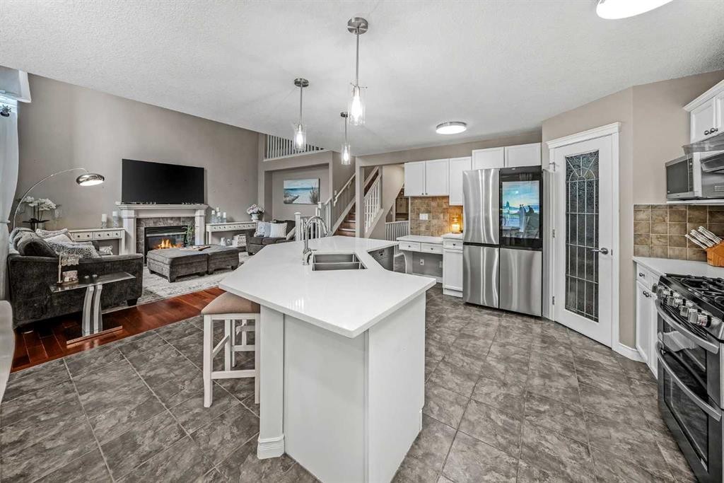 66 Crestmont Drive Sw, Calgary, AB - Indoor Photo Showing Kitchen With Double Sink With Upgraded Kitchen