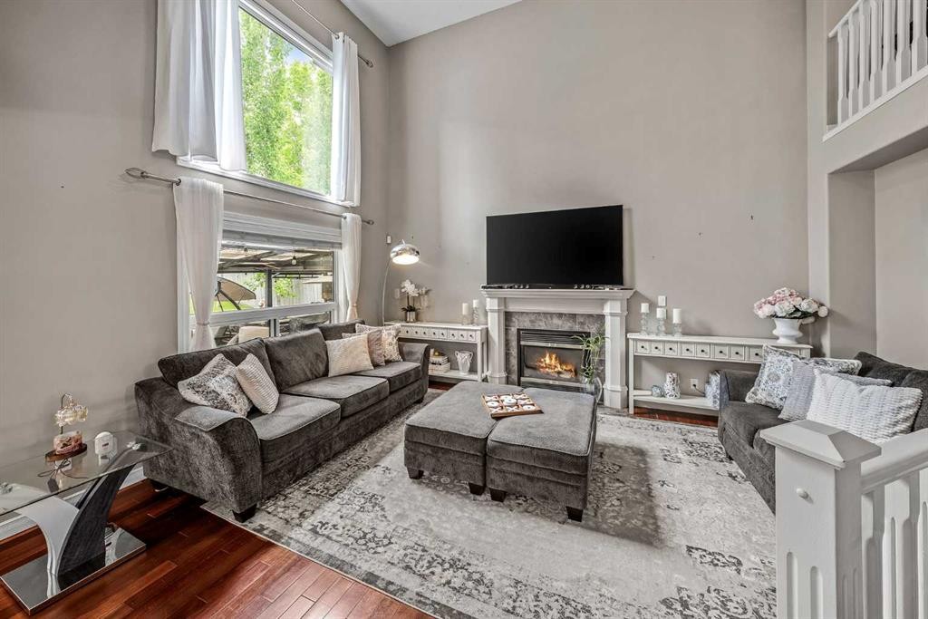 66 Crestmont Drive Sw, Calgary, AB - Indoor Photo Showing Living Room With Fireplace