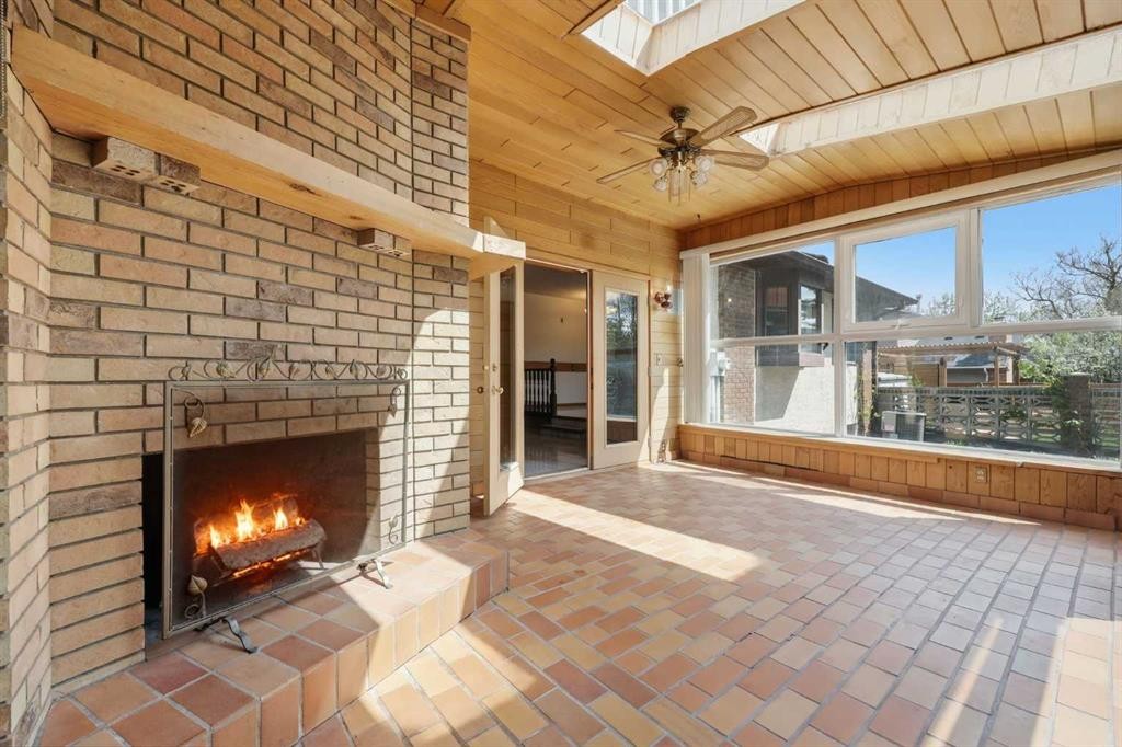 480 Berkley Crescent Nw, Calgary, AB - Indoor Photo Showing Living Room With Fireplace