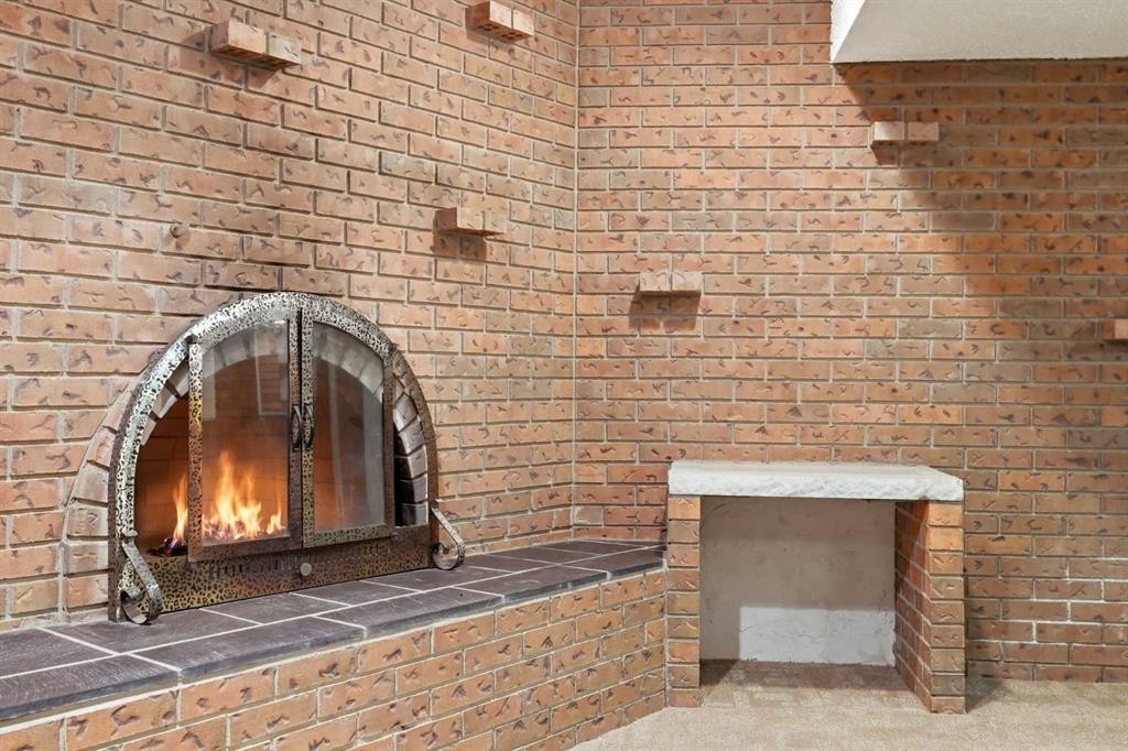 480 Berkley Crescent Nw, Calgary, AB - Photo Showing Other Room With Fireplace