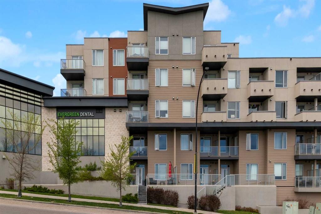 101-30 Shawnee Common Sw, Calgary, AB - Outdoor With Balcony With Facade