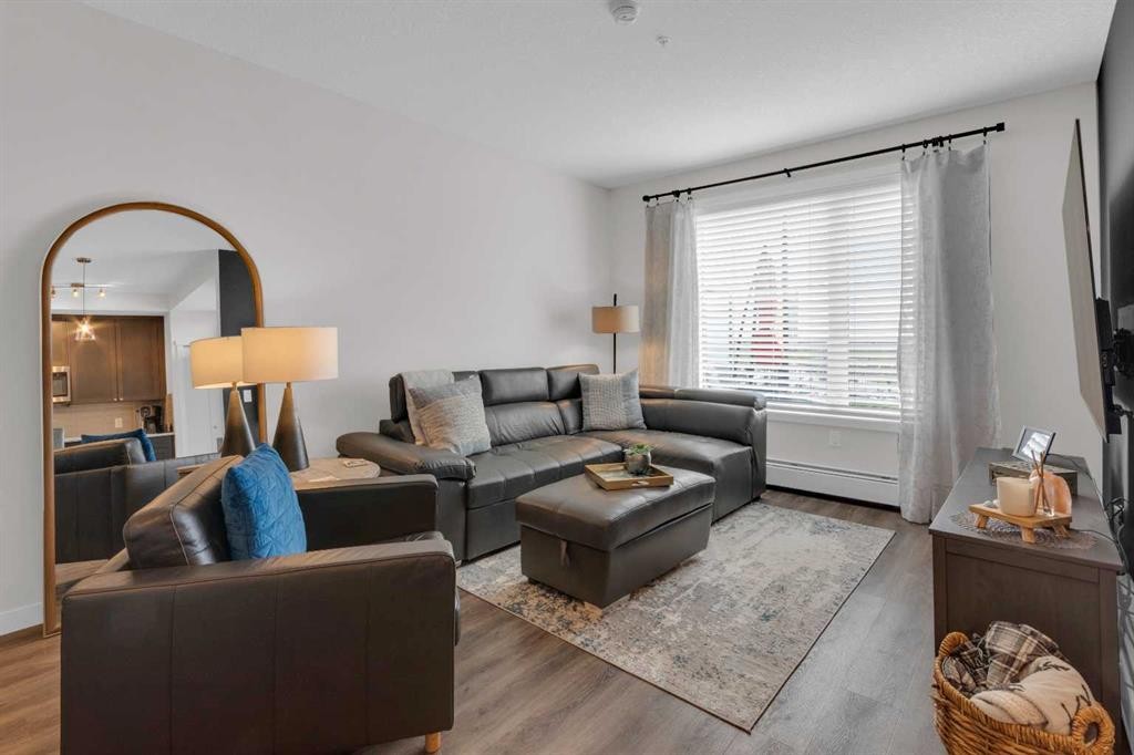 101-30 Shawnee Common Sw, Calgary, AB - Indoor Photo Showing Living Room