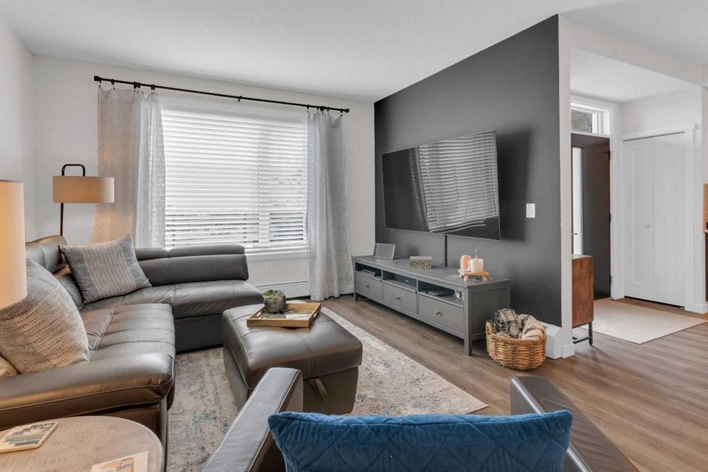 101-30 Shawnee Common Sw, Calgary, AB - Indoor Photo Showing Living Room