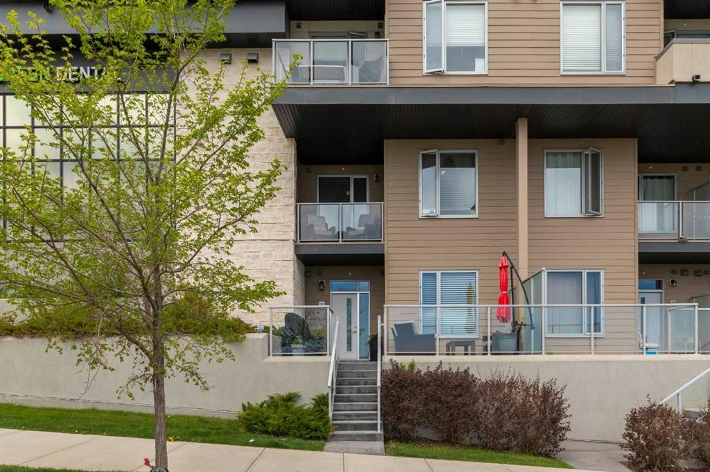 101-30 Shawnee Common Sw, Calgary, AB - Outdoor With Balcony With Facade