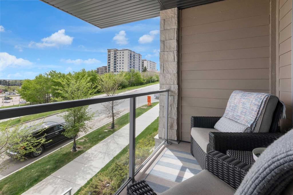 101-30 Shawnee Common Sw, Calgary, AB - Outdoor With Balcony With Exterior