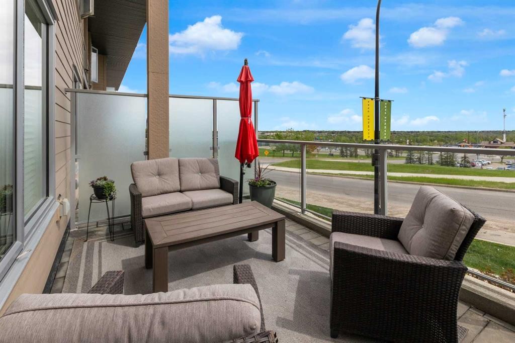 101-30 Shawnee Common Sw, Calgary, AB - Outdoor With Balcony With Exterior