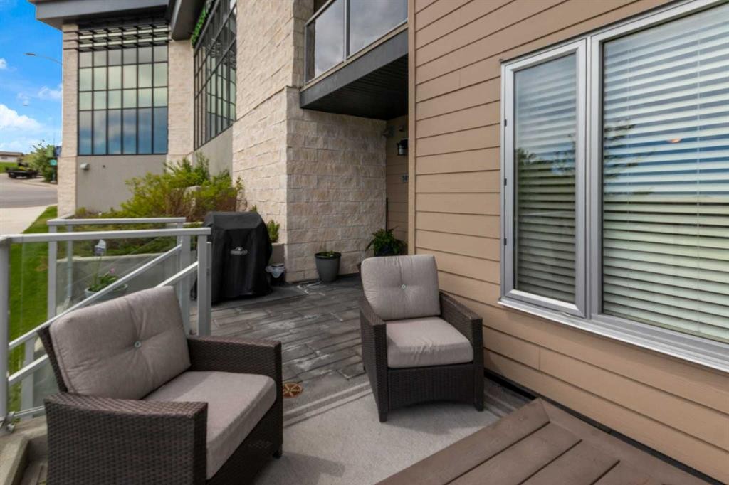 101-30 Shawnee Common Sw, Calgary, AB - Outdoor With Balcony With Deck Patio Veranda With Exterior
