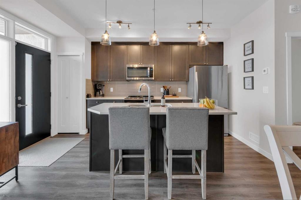 101-30 Shawnee Common Sw, Calgary, AB - Indoor Photo Showing Kitchen With Stainless Steel Kitchen With Upgraded Kitchen