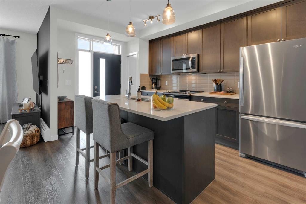 101-30 Shawnee Common Sw, Calgary, AB - Indoor Photo Showing Kitchen With Stainless Steel Kitchen With Upgraded Kitchen