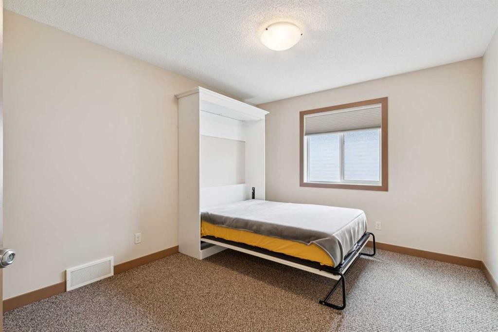 47 Silverado Skies Manor Sw, Calgary, AB - Indoor Photo Showing Bedroom