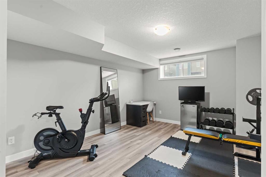 46 Corner Meadows Common Ne, Calgary, AB - Indoor Photo Showing Gym Room