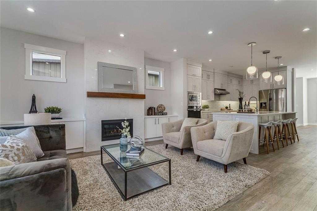 3122 39 Street Sw, Calgary, AB - Indoor Photo Showing Living Room With Fireplace