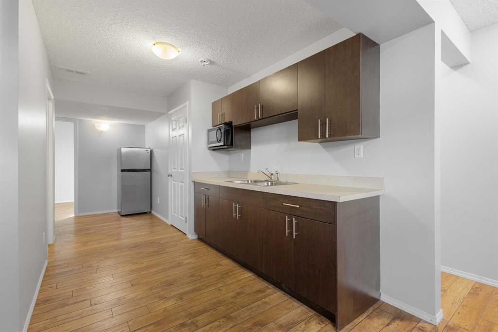 49 Auburn Crest Lane Se, Calgary, AB - Indoor Photo Showing Kitchen With Double Sink