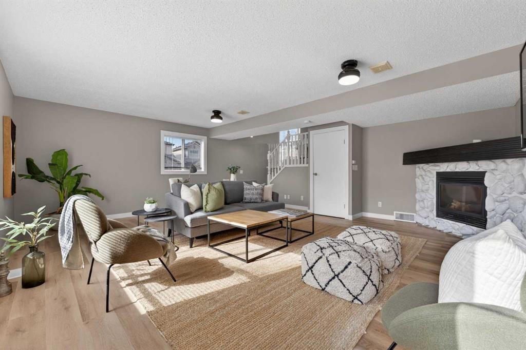 160 Citadel Bluff Close Nw, Calgary, AB - Indoor Photo Showing Living Room With Fireplace