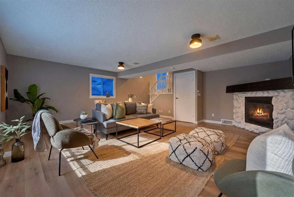 160 Citadel Bluff Close Nw, Calgary, AB - Indoor Photo Showing Living Room With Fireplace