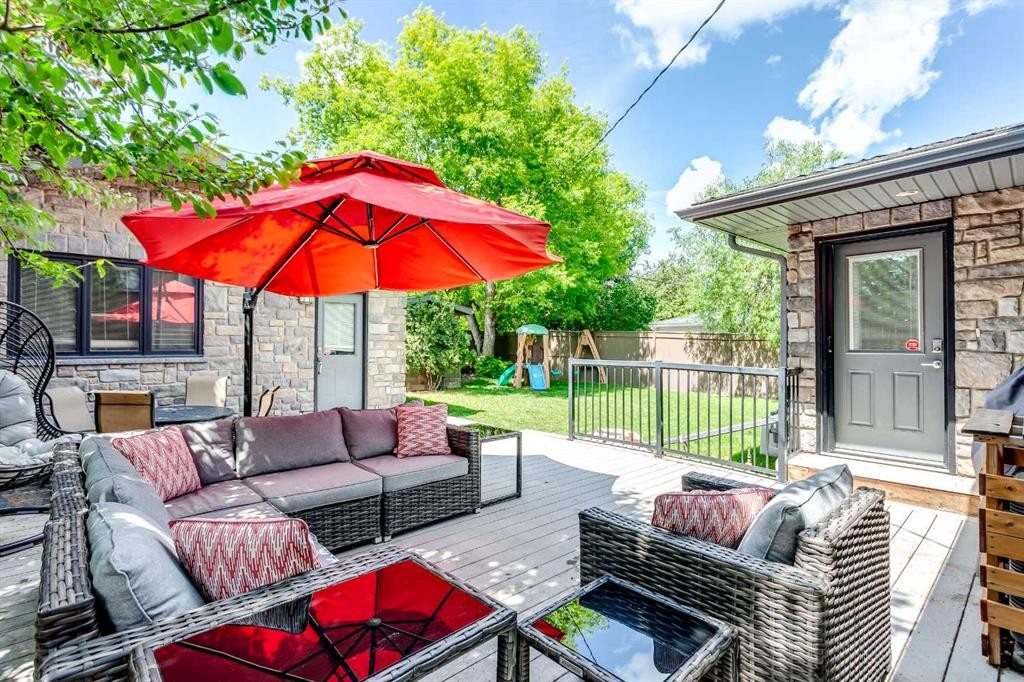 51 Wimbledon Drive Sw, Calgary, AB - Outdoor With Fireplace With Deck Patio Veranda With Exterior