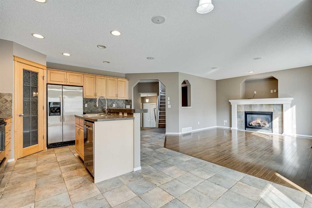 34 Kincora Drive Nw, Calgary, AB - Indoor Photo Showing Kitchen With Fireplace