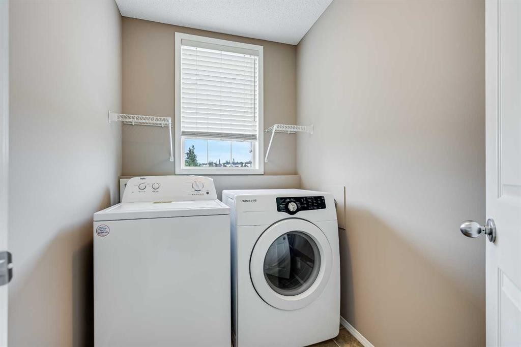 34 Kincora Drive Nw, Calgary, AB - Indoor Photo Showing Laundry Room