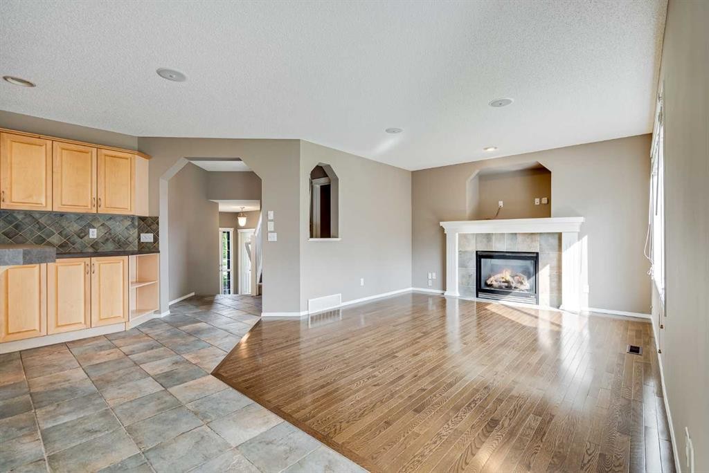 34 Kincora Drive Nw, Calgary, AB - Indoor Photo Showing Living Room With Fireplace