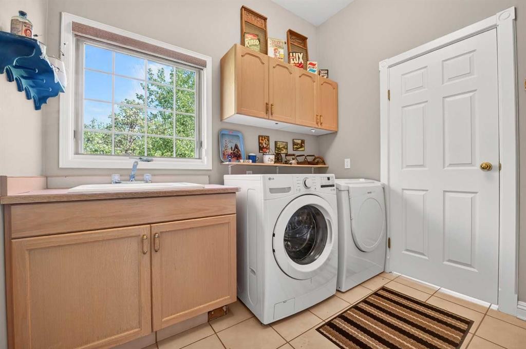 5930 C + E Trail, Lacombe, AB - Indoor Photo Showing Laundry Room