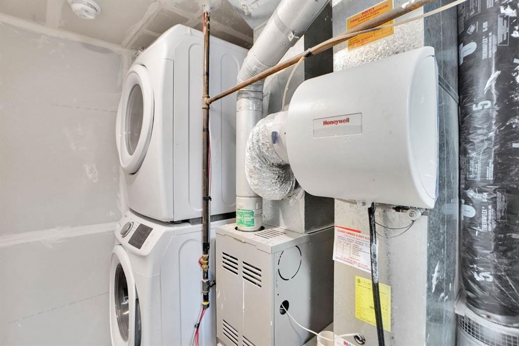 71 Saddlemont Road Ne, Calgary, AB - Indoor Photo Showing Laundry Room