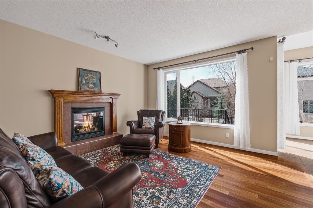 430 Discovery Ridge Boulevard Sw, Calgary, AB - Indoor Photo Showing Living Room With Fireplace