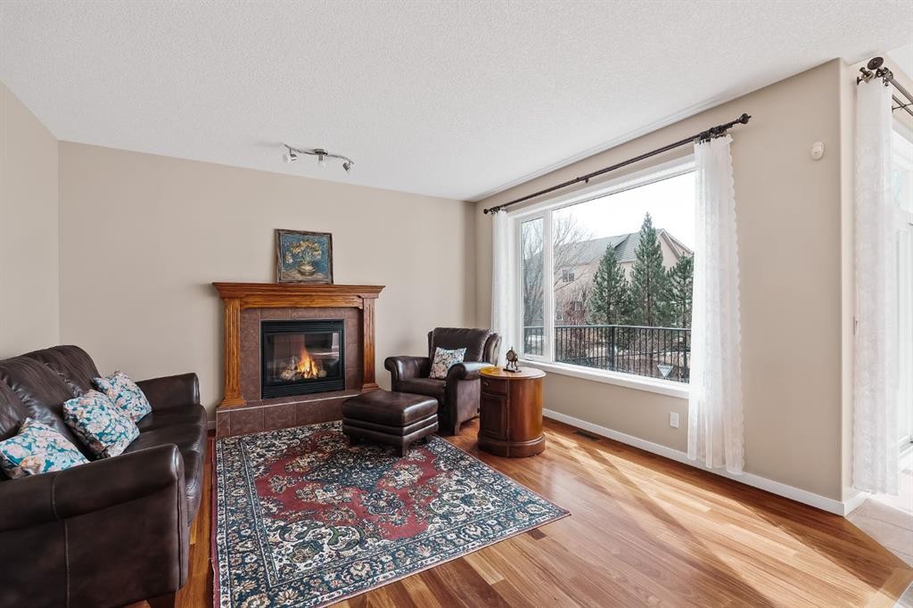 430 Discovery Ridge Boulevard Sw, Calgary, AB - Indoor Photo Showing Living Room With Fireplace