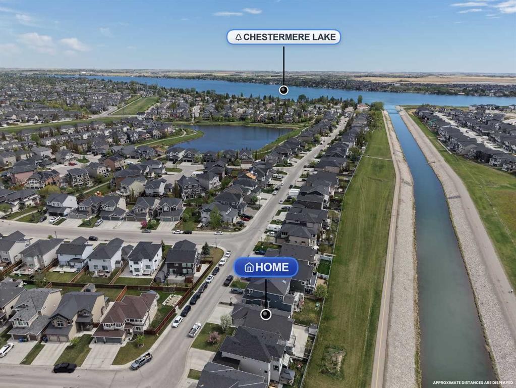 248 Rainbow Falls Way, Chestermere, AB - Outdoor With Body Of Water With View