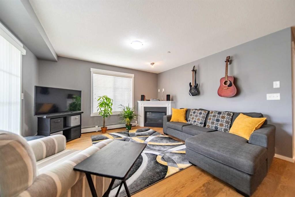 4318-99 Copperstone Park Se, Calgary, AB - Indoor Photo Showing Living Room With Fireplace