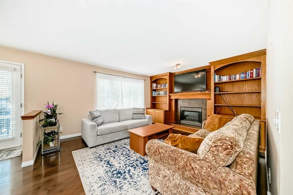 327 Hidden Ranch Circle Nw, Calgary, AB - Indoor Photo Showing Living Room With Fireplace