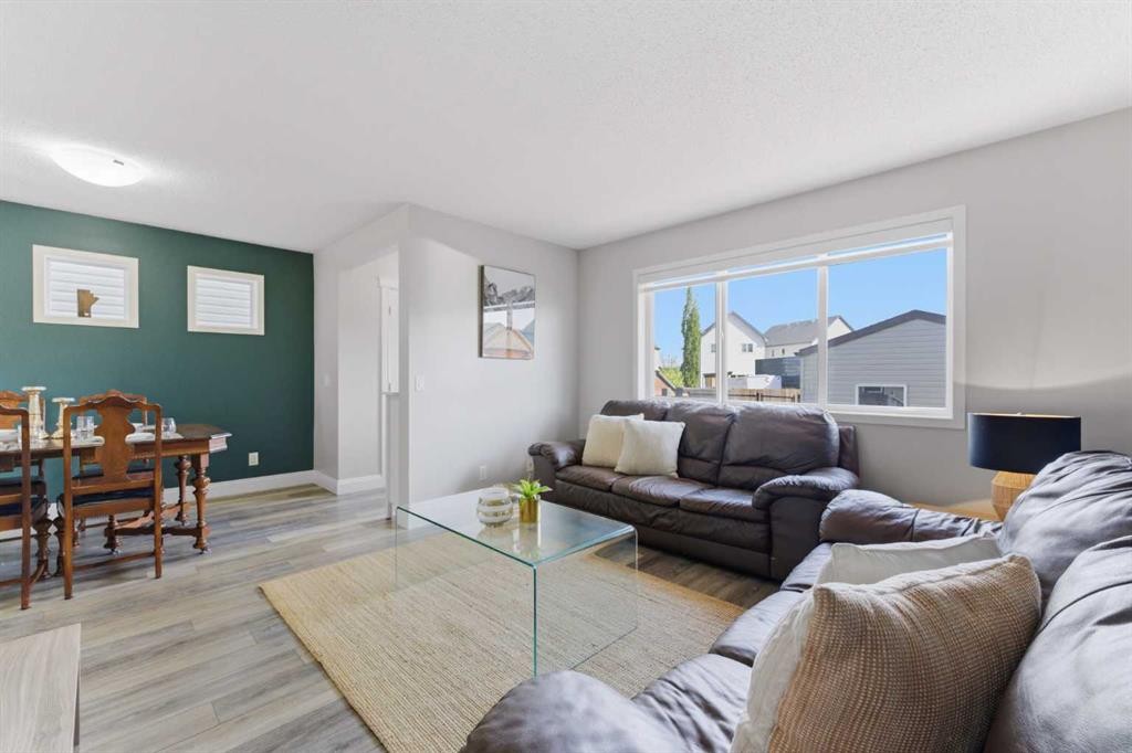 394 Copperpond Boulevard Se, Calgary, AB - Indoor Photo Showing Living Room