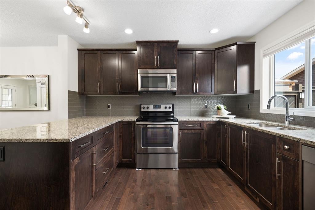 54 Legacy Common Se, Calgary, AB - Indoor Photo Showing Kitchen With Double Sink With Upgraded Kitchen