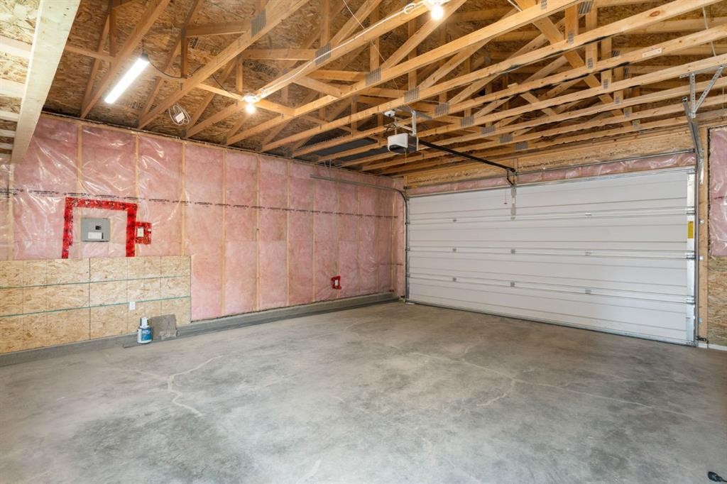 54 Legacy Common Se, Calgary, AB - Indoor Photo Showing Garage
